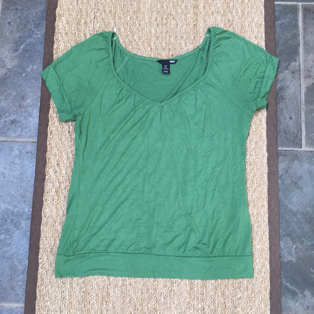 Green blouse.